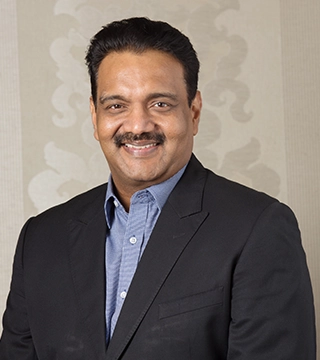 Dr. A.S. Ganesan chairman of VIMS Hospitals Salem known for excellence in healthcare and education.